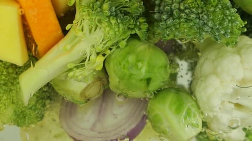 Vegetable mix for making soup in boiling water with air bubbles.