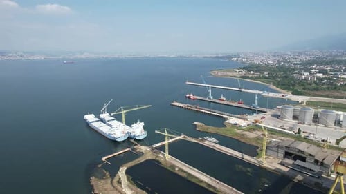 Aerial View of a Busy Port with Cargo Ships