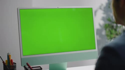 Chroma Key Computer Monitor at Workplace Closeup. Specialist Working Surfing Web In