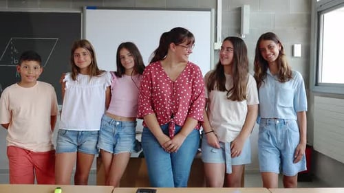 Portrait of Small Group of Elementary School Students with Teacher in Class