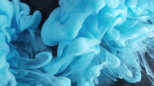 Mesmerizing Blue Ink Swirling in Dark Water