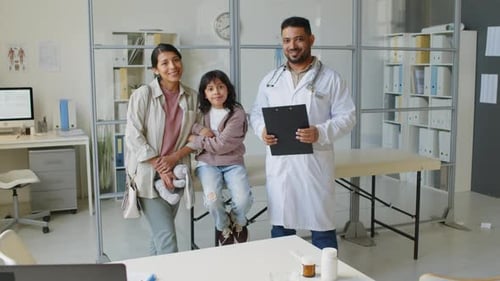 Portrait of Little Girl with Mom and Pediatrician in Medical Office