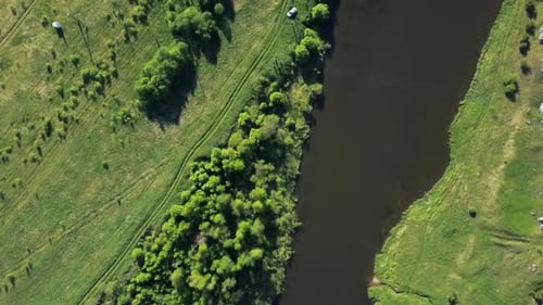Experience a Stunning Scenic Aerial View of a River That is Beautifully Surrounded By Lush Greenery