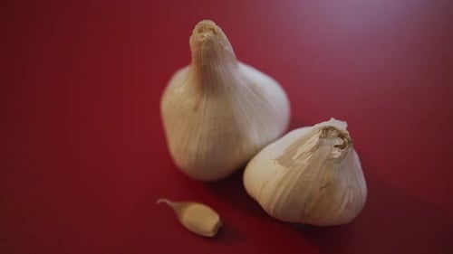 Panning Close Up of Garlic on a Cutting Board