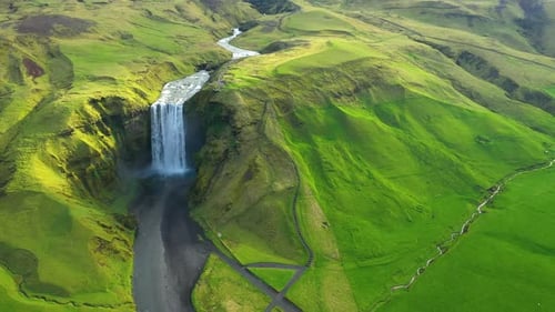 Aerial slow motion view of breathtaking Skogafoss waterfall, Iceland
