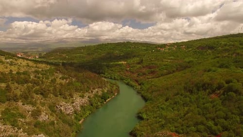 A beautiful river next to a small village.