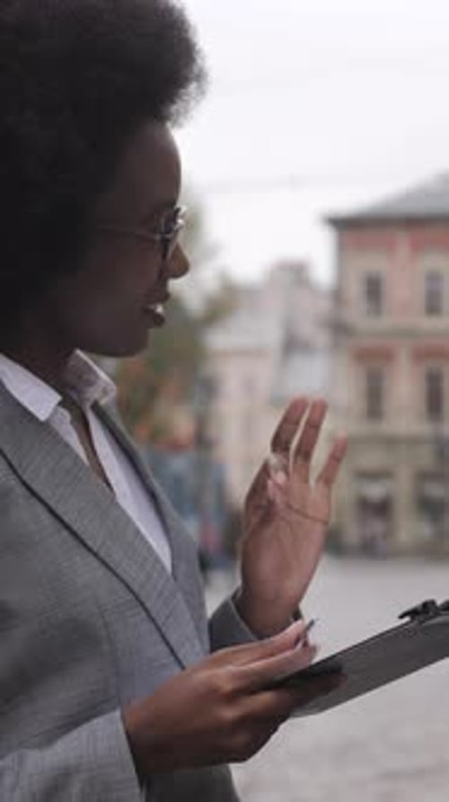 African Business Colleagues Standing on Street and Talking