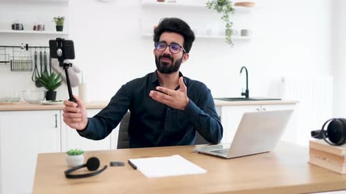 Young Man Recording Video in Bright Kitchen