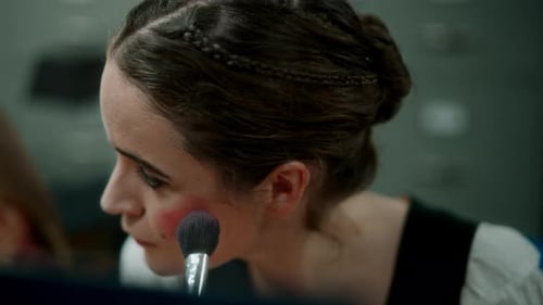 Woman Applying Makeup with Blush Brush