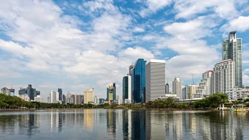 Modern Urban Skyline Reflection Over Water in Bangkok, Thailand