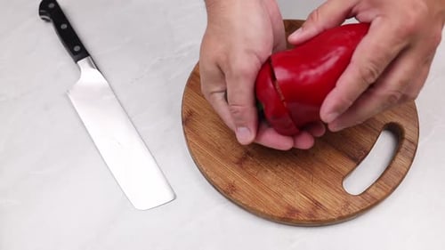 Cutting Red Bell Pepper on Cutting Board