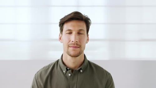 Man, face and smile in office at startup with pride, confidence and career in hallway at media