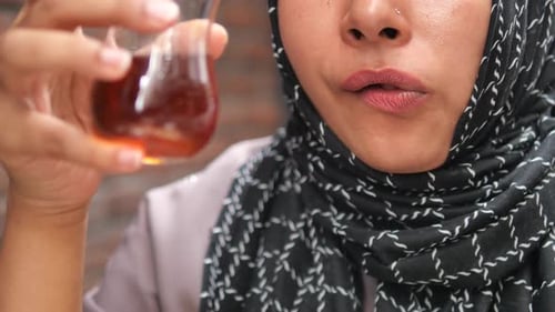 Enjoying a Warm Drink in a Cozy Cafe