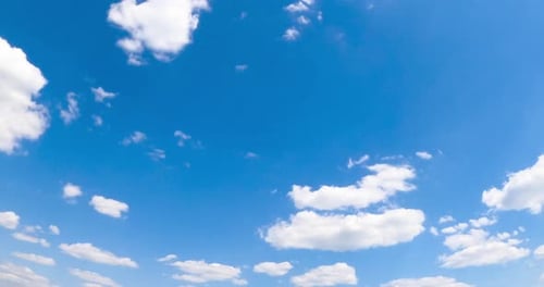 Clouds Moving Gently Across Blue Sky During Daytime