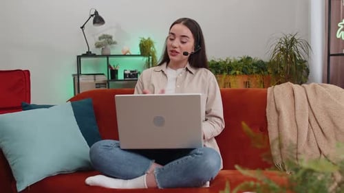 Young Woman Freelance Worker Call Center Support Service Operator Helpline Having Talk with Client