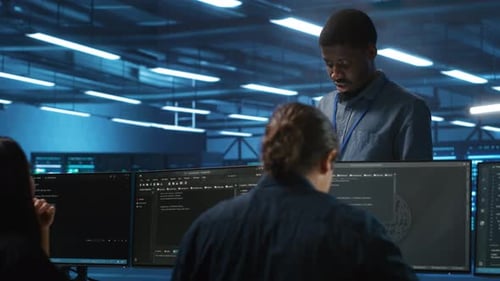 Supervisor in Server Hub Workplace Managing Diverse Team of Developers