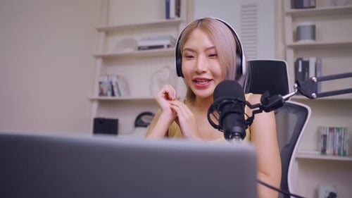 Woman Podcasting or Streaming in Home Studio