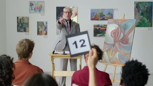 Auctioneer Selling Contemporary Painting on Art Auction