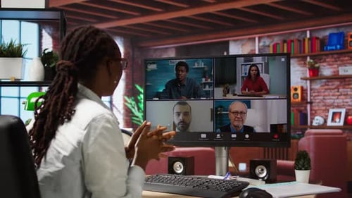 Remote Worker in Home Office Saluting Coworkers During Internet Videocall