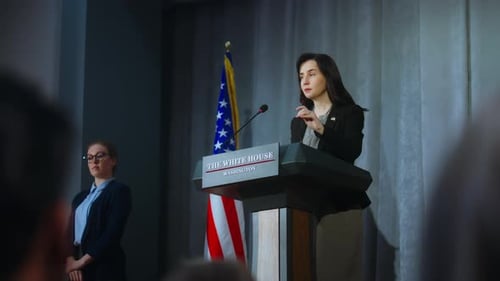 Woman Speaking at Podium with American Flag