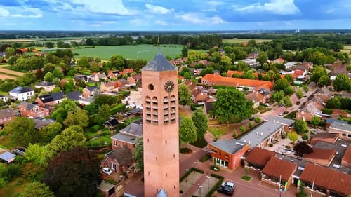 Tall brick clock tower of Saint Lawrence Church.