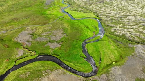 Mountain River with Bizarre Shapes Curved Shape River Flows High in the Mountains in Iceland Summer