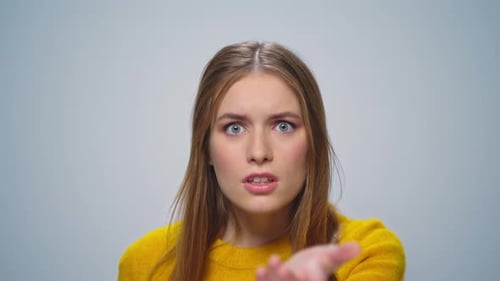 Woman Confused and Talking on Light Background
