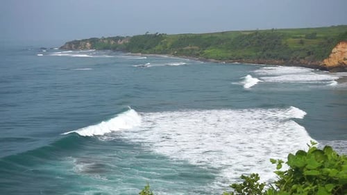 vast expanse of sea, coastline with blue sea water with big waves during the day