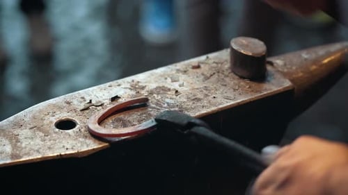 Close up of Blacksmith making a horseshoe