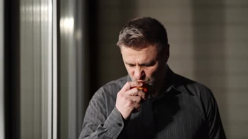 Middle Aged Man Eating an Apple Close Up