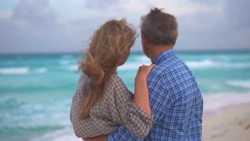 Romantic Middleaged Couple Enjoying a Peaceful Evening Together on the Beach Love Connection and
