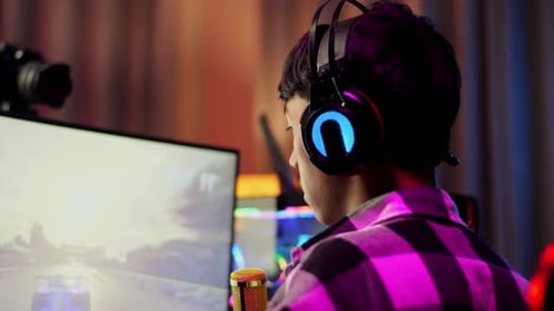 Asian Boy Streamer Celebrating Winning Game On Computer. Live Stream Video Game