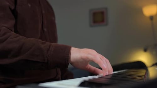 Man Plays Electronic Piano in Home Interior