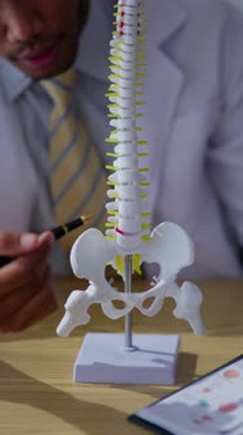 Doctor explaining about sickness and disease to patient and medical studeent in hospital