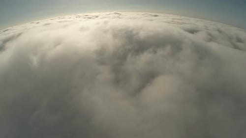 Aerial View Over a White, Billowing Cloudscape