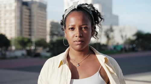 Pretty Young African American Latin Woman Portrait Looking at Camera Smile in the Urban City Street