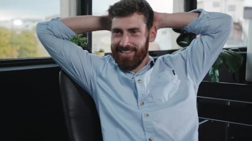 A Modern Office Workspace Featuring Greenery and Advanced Technology for Productivity