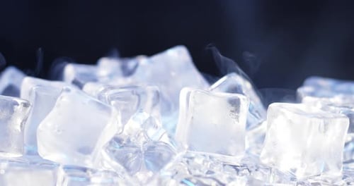 Pile of Ice Cubes with wisps of smoke