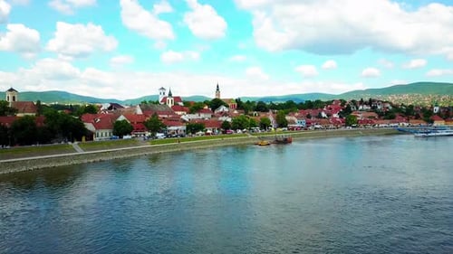 Aerial flyover charming Eastern European town Szentendre along the Danube River. 4K