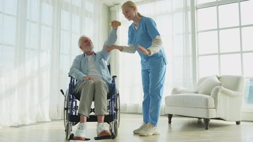 Senior Man Doing Arm Exercise with Physical Therapist