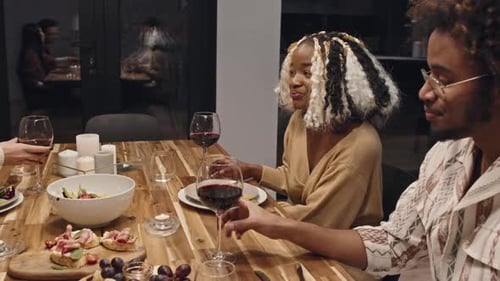 Friends Gathered for Dinner Celebrate with Wine