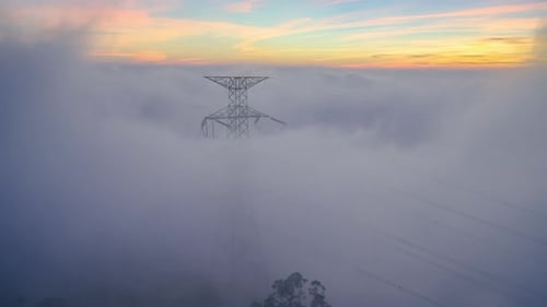 High Voltage Power Tower in Sea of Clouds at Sunset, Meishan, Taiwan
