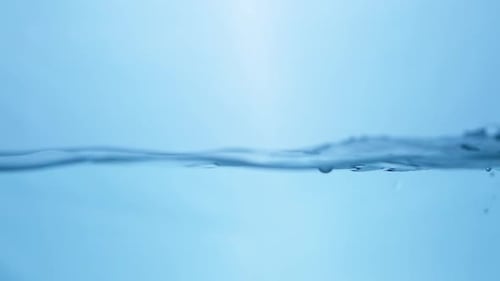 Liquid Tranquility Smooth Flowing Water Surface in Slow Motion. Blue Bliss Abstract Water Background