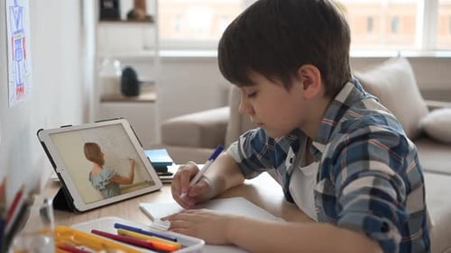 Boy Doing Homework with Online Teacher on Tablet