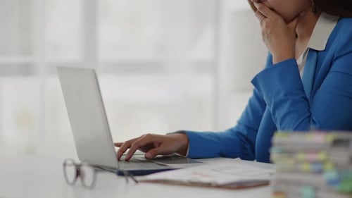 Businesswoman is seriously stressed working feel eye ache headache due to office syndrome.