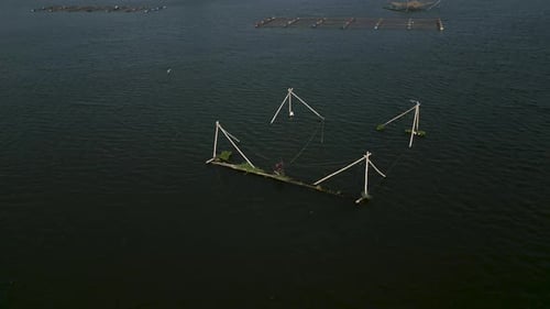 Drone Flying Over Tri an Lake Vietnam Over Fishing Nets in the Center of the Lake in the Water