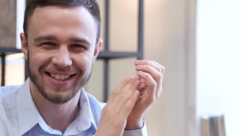 Smiling Man Clapping Hands Inside