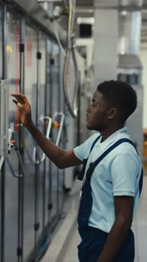 Vertical of Beverage Plant Technician Controlling Machinery Operation