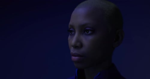 Captivating Portrait of a Woman in Dramatic Lighting and Color Palette