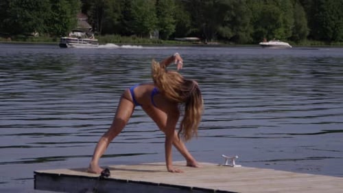 Bikini Model -Yoga summer vacation fun on the dock in slow motion